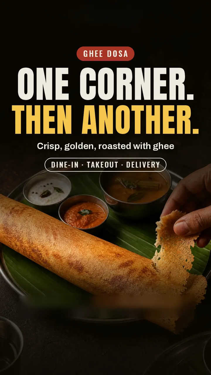 Ghee dosa, crisp and golden, roasted with ghee and torn one corner at a time.